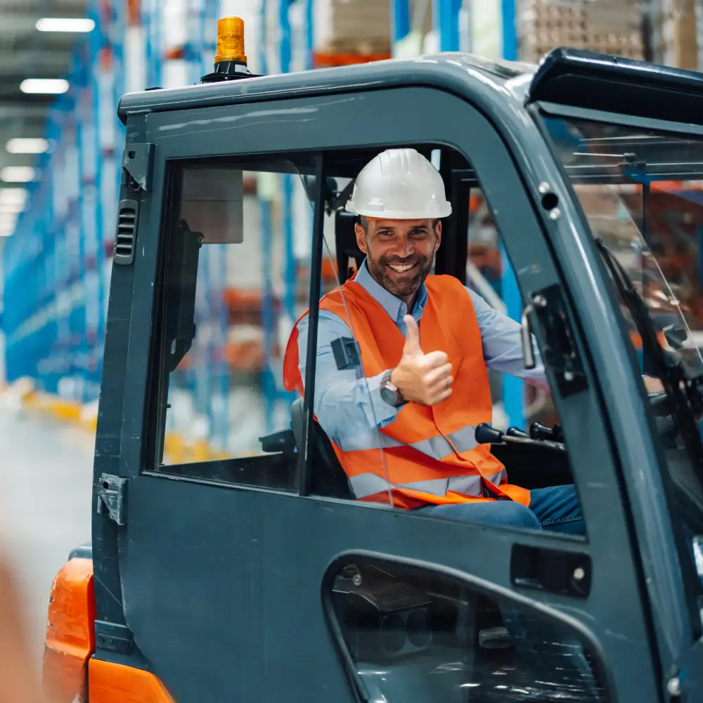 forklift operator scanning pallet with barcode reader